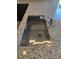 Close up of a kitchen sink with a modern faucet set into a granite countertop at 178 Vili Dr, Broadway, NC 27505