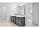 Bathroom features a double vanity, a large mirror, and neutral color palette at 2750 Lacy Holt Rd, Graham, NC 27253