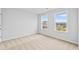 A bedroom with two windows offering natural light and neighborhood views at 2750 Lacy Holt Rd, Graham, NC 27253