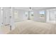 Spacious bedroom with multiple windows offering natural light and plush carpeting at 2750 Lacy Holt Rd, Graham, NC 27253