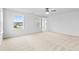 Bright and airy bedroom with multiple windows, plush carpet, and neutral tones at 2750 Lacy Holt Rd, Graham, NC 27253