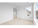 Large bedroom featuring plush carpet, natural light and open doorway to next room at 2750 Lacy Holt Rd, Graham, NC 27253