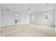 Large bedroom featuring plush carpet, natural light, ceiling fan and doorway to hall at 2750 Lacy Holt Rd, Graham, NC 27253