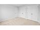 A bedroom with neutral carpet and white doors offers ample storage at 2750 Lacy Holt Rd, Graham, NC 27253