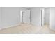 Bedroom with neutral carpet and entrances to a closet and the hallway at 2750 Lacy Holt Rd, Graham, NC 27253