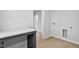 The Laundry room features new laminate floors, washer and dryer hookups, and a folding table at 2750 Lacy Holt Rd, Graham, NC 27253