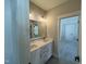 Modern bathroom with double vanity and a large mirror at 314 Hinton St, Apex, NC 27502