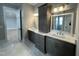 Elegant bathroom with double vanity, large mirror, and marble flooring at 314 Hinton St, Apex, NC 27502