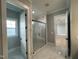 Spa-like bathroom featuring a large walk-in shower and marble tile at 314 Hinton St, Apex, NC 27502