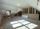 Spacious unfinished bonus room boasts natural light at 314 Hinton St, Apex, NC 27502