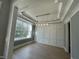 Elegant dining room with wainscoting, hardwood floors, and a modern chandelier at 314 Hinton St, Apex, NC 27502