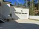 Attached garage with white door and concrete pad at 314 Hinton St, Apex, NC 27502