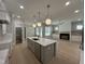 Open concept kitchen with island and stainless steel appliances at 314 Hinton St, Apex, NC 27502