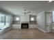 Spacious living room with fireplace, built-in shelving, and hardwood floors at 314 Hinton St, Apex, NC 27502