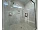 Spacious walk-in shower with built-in seat and pebble floor at 314 Hinton St, Apex, NC 27502