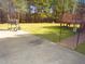 Spacious backyard with an inviting area for outdoor grilling, entertainment, and relaxing at 3214 Tump Wilkins Rd, Stem, NC 27581