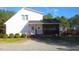 Two-story home with white siding and a screened porch with decorative trim and an inviting front entry at 3214 Tump Wilkins Rd, Stem, NC 27581