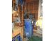 The garage storage area contains a blue air compressor along with other mechanical and electrical components at 3214 Tump Wilkins Rd, Stem, NC 27581