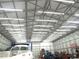 The interior of the outbuilding is spacious, brightly lit, and well-suited for storage or workshop activities at 3214 Tump Wilkins Rd, Stem, NC 27581