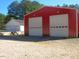 Outbuilding with two garage doors, accompanied by another building, great for storage at 3214 Tump Wilkins Rd, Stem, NC 27581