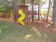 Backyard playset featuring a slide and swing set, creating a fun outdoor space at 3214 Tump Wilkins Rd, Stem, NC 27581