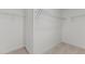 Walk-in closet with wire shelving and carpeted flooring at 35 Arbor Dr, Youngsville, NC 27596