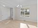 Bright dining room with hardwood floors and large window at 35 Arbor Dr, Youngsville, NC 27596