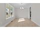 Bright dining room with hardwood floors and large window at 35 Arbor Dr, Youngsville, NC 27596