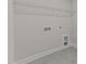 Laundry room with utility hookups and wire shelving at 35 Arbor Dr, Youngsville, NC 27596