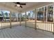 Wooden screened porch overlooking wooded backyard at 35 Arbor Dr, Youngsville, NC 27596