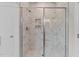 Large walk-in shower with marble-look tile at 35 Arbor Dr, Youngsville, NC 27596