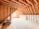 Unfinished attic space with exposed wood beams offers potential for customization at 505 Rossie Jones Rd Rd, Zebulon, NC 27597