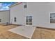 Backyard features a concrete patio and sliding glass door that provides natural light at 517 Southwick Pl, Mebane, NC 27302