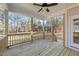 Wooden back porch with ceiling fan and wooded views at 75 Arbor Dr, Youngsville, NC 27596