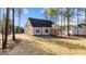 House backyard with large grassy area and trees at 75 Arbor Dr, Youngsville, NC 27596