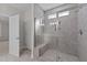Modern bathroom with a large walk-in shower and tiled walls at 75 Arbor Dr, Youngsville, NC 27596