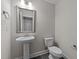 Simple bathroom with pedestal sink and toilet at 75 Arbor Dr, Youngsville, NC 27596