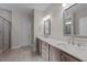 Bathroom with double vanity, quartz countertops, and shower at 75 Arbor Dr, Youngsville, NC 27596