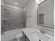 Clean bathroom with a tub, shower, and vanity at 75 Arbor Dr, Youngsville, NC 27596