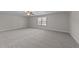 Spacious bedroom with neutral carpeting and large window at 75 Arbor Dr, Youngsville, NC 27596