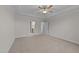 Spacious bedroom with carpeted floors, ceiling fan, and ensuite bathroom at 75 Arbor Dr, Youngsville, NC 27596