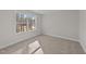 Bright bedroom with neutral carpeting and a large window at 75 Arbor Dr, Youngsville, NC 27596