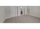 Spacious bedroom with carpet, doors to bathroom and stairs at 75 Arbor Dr, Youngsville, NC 27596