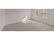 Spacious bedroom with neutral carpeting and a window at 75 Arbor Dr, Youngsville, NC 27596
