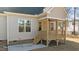 Exterior view of home with covered porch and deck at 75 Arbor Dr, Youngsville, NC 27596