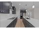 Modern kitchen with dark cabinetry, white countertops, and island at 75 Arbor Dr, Youngsville, NC 27596