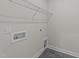Laundry room with shelving and hookups for washer/dryer at 75 Arbor Dr, Youngsville, NC 27596
