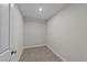 Small storage room with carpeted floor and door at 75 Arbor Dr, Youngsville, NC 27596