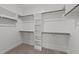 Spacious walk-in closet with ample shelving and hanging space at 75 Arbor Dr, Youngsville, NC 27596