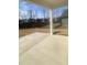 Covered patio overlooks fenced backyard with mature trees at 110 Sawtooth Oak Ln, Youngsville, NC 27596
